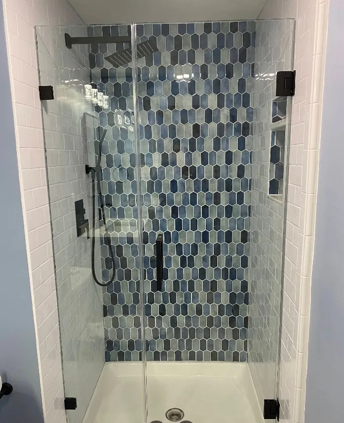 Tiled shower with a mosaic tile accent