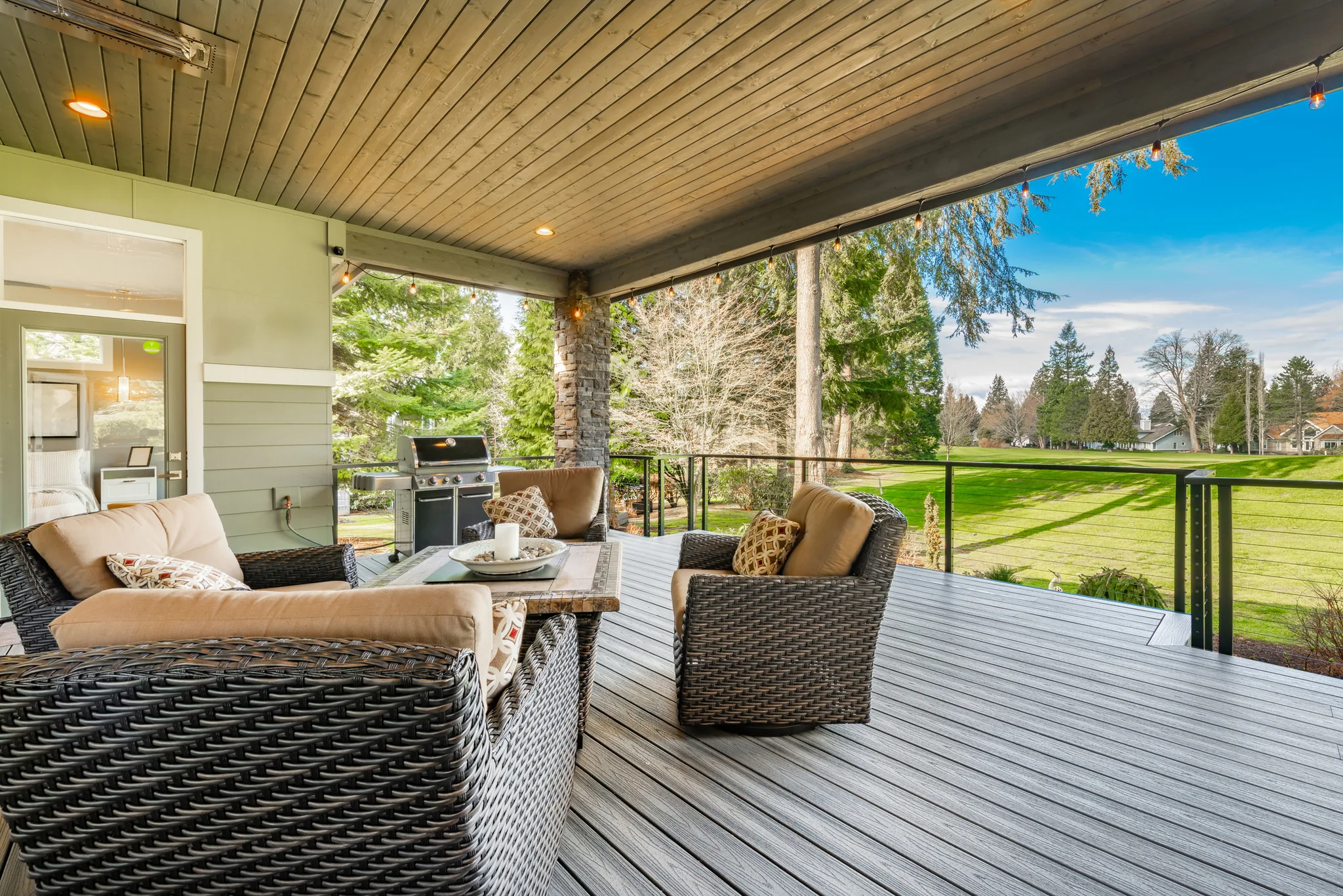 Covered composite deck with railings and outdoor seating