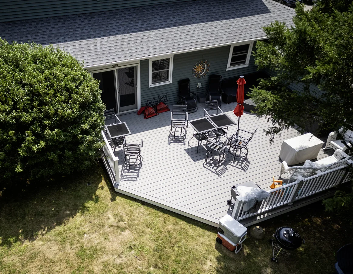 Low rear deck a step off the ground on a flat, level lot