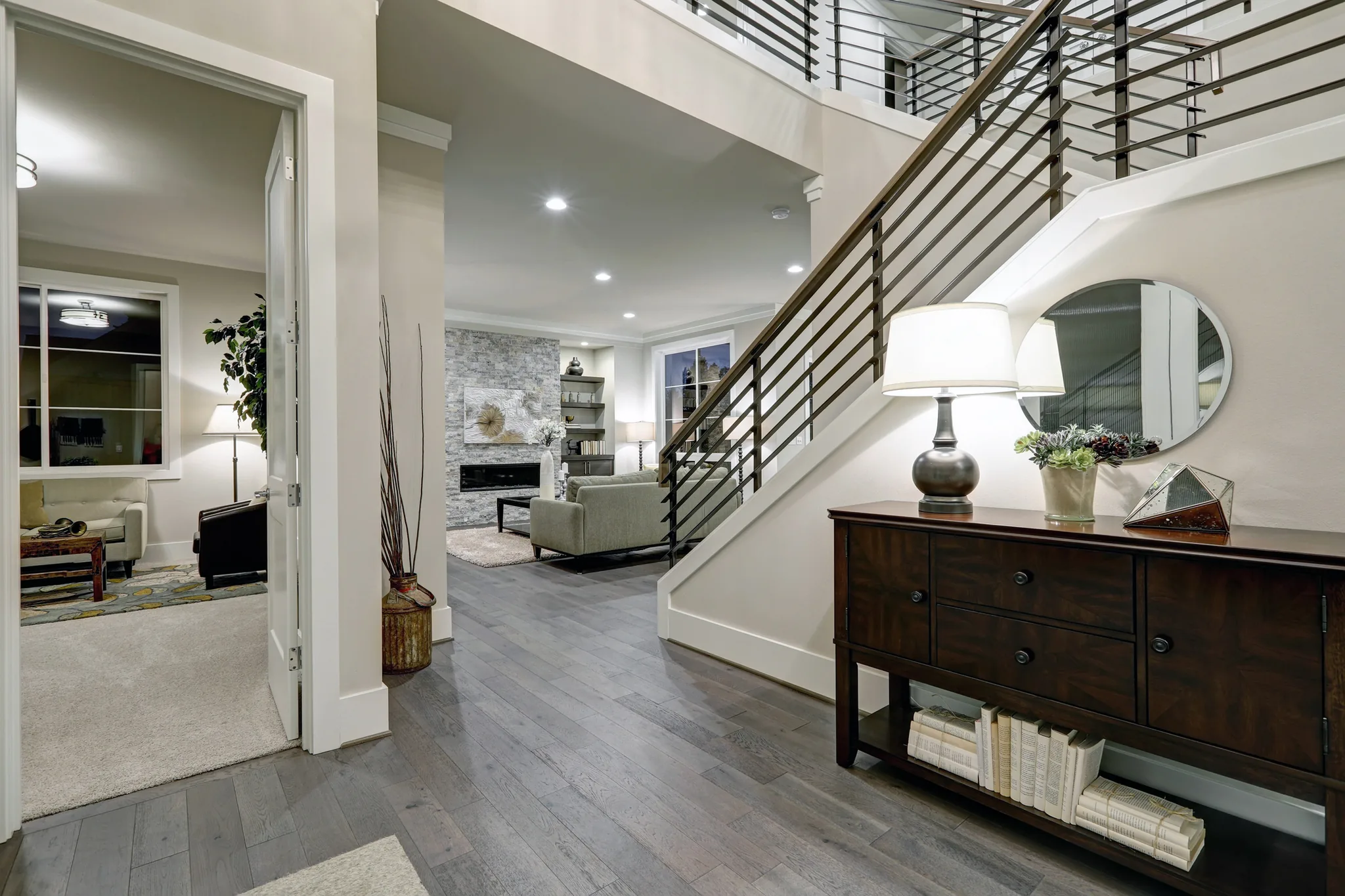 Home remodeling in Seat Pleasant, MD: entry hall with wood flooring, an open stair and a living room beyond